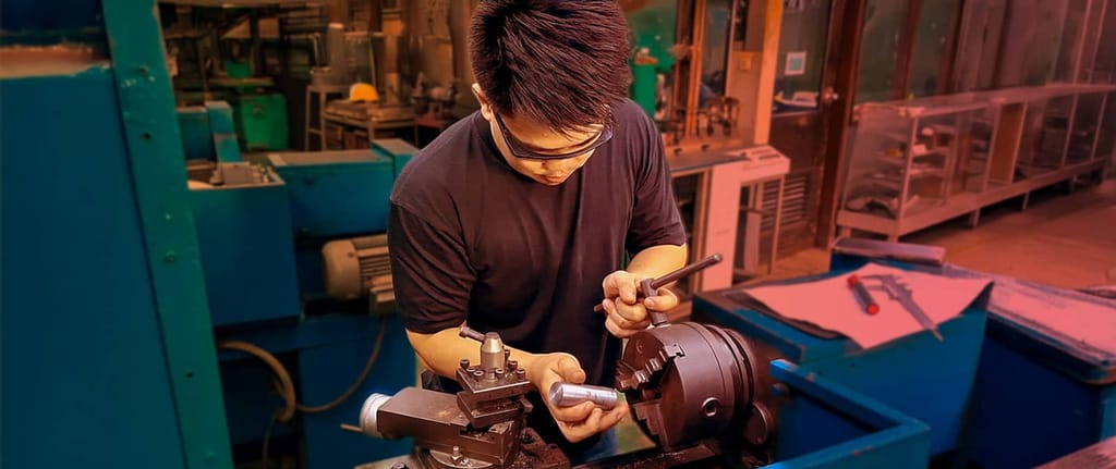 Skilled worker using machinery